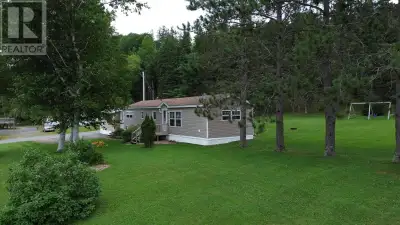 This meticulously kept mini home sits on a 3 acre private oasis, and with a additional 16'x 18' livi...