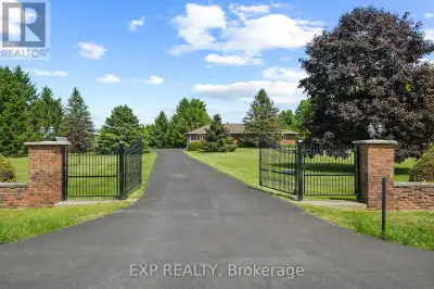 Serene Country Living Just Minutes from the City! Welcome to your dream retreat an all-brick bungalo...