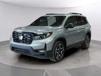 Meet the 2023 Honda Passport Touring AWD, a captivating silver SUV designed for those who demand sty...