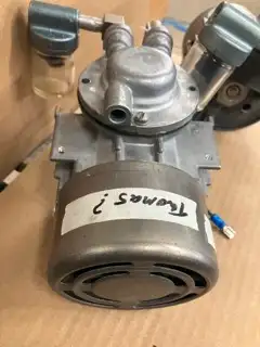 Small 110V diaphragm pump. Up to 17Hg vacuum or 40psi pressure. Similar to Thomas or Welch pumps. 2...