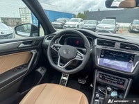 The 2024 Volkswagen Tiguan Comfortline R-Line Black Edition elevates every journey with its distinct... (image 8)
