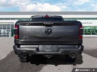 This 2021 Ram 1500 Sport Crew Cab, striking in Granite Crystal Metallic, stands ready for action, bo... (image 3)
