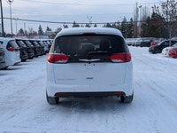 The 2026 Chrysler Grand Caravan SXT in Bright White with a Black interior offers the perfect blend o... (image 4)