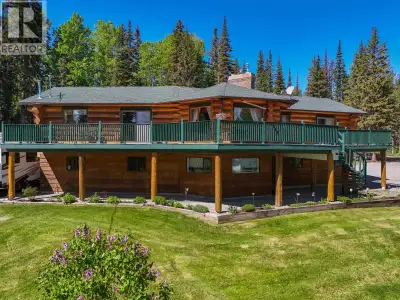 Welcome to this impressive executive log home, perfectly situated on a beautiful 1-acre lot with swe...