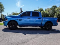 The 2021 Ram 1500 Classic Express 4x4 Crew Cab 57 Box is ready to tackle any road with its striking... (image 4)