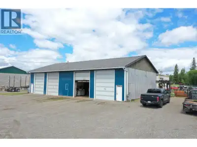 Well-maintained two-bay commercial garage/shop on its own land. Features 14-foot ceilings, a mezzani...