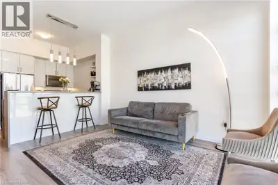 Welcome to Unit 504 at 10 Concord Place, where modern lakeside living meets convenience in the heart...
