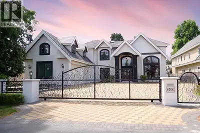 Stunning, luxurious, custom-built home in the heart of Woodwards. Over height ceilings with entry an...