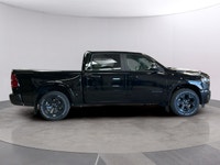 The 2026 Ram 1500 Big Horn 4x4 Crew Cab 57 Box comes in a striking Diamond Black Crystal Pearl finis... (image 5)