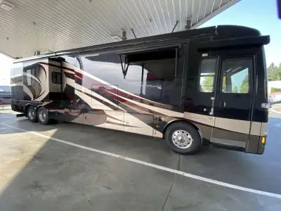 The Mountain Aire 4369 motor home by Newmar offers triple slides and a bath and a half. As you enter...