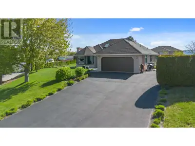 Embrace your Okanagan alfresco lifestyle in this beautiful EXECUTIVE home nestled on a quiet,no-thru...