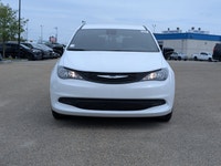 The 2026 Chrysler Grand Caravan SXT in Bright White with a Black interior offers a perfect balance o... (image 9)