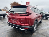 Command the road in the breathtaking Radiant Red Metallic 2021 Honda CR-V Touring, a sophisticated s... (image 4)