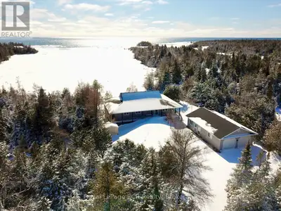 EFFICIENT 4-season COTTAGE or HOME on 3/4 ACRE of PRIME LAKE HURON WATERFRONT in the desirable Warne...