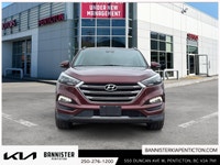 Experience the 2016 Hyundai Tucson Ultimate in its striking red exterior, offering the confidence of... (image 1)