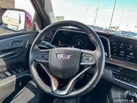 The 2021 Cadillac Escalade includes a panoramic sunroof, power-retractable running boards, hands-fre... (image 8)