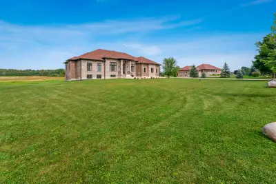 Custom-built bungalow featuring extensive upgrades throughout. A welcoming foyer with over 12-foot c...