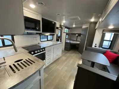 Keystone Cougar Half-Ton travel trailer 25DBSWE highlights: Flip-Up Bunk Private Bedroom Outdoor Kit...