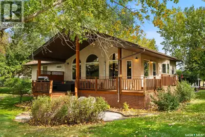 Check out this Fabulous waterfront property (144' of sandy beach) with oversize double car garage an...