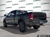 The 2016 Ram 2500 Laramie, finished in an elegant black exterior paired with a sophisticated black i... (image 3)