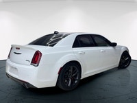 The 2023 Chrysler 300, particularly the 300C RWD in pristine white, is a powerful sedan that truly s... (image 7)