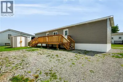 Welcome to this completely gutted and extensively renovated 2-bedroom, 1-bathroom mini home in the d...