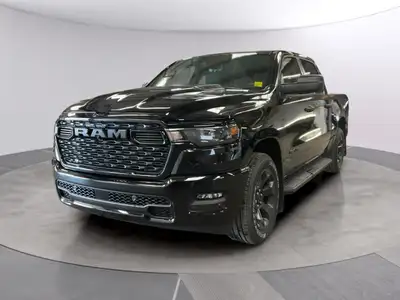 The 2026 Ram 1500 Express 4x4 Crew Cab 57 Box is a powerful yet stylish black truck thats ready for...
