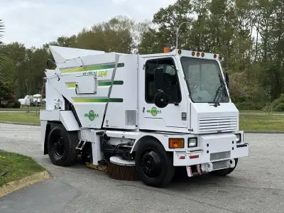 This 2012 Global M4 rear high dump broom sweeper is powered by a 6.7L 6-cylinder diesel engine paire...