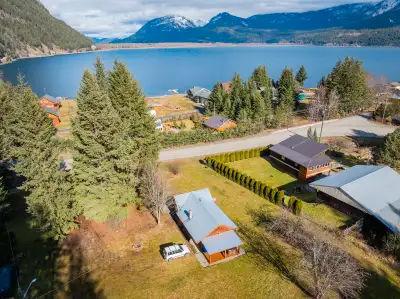 Escape to your personal lakeside haven! This charming cottage, set on a flat lot in Lardeau, BC, off...
