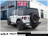 The 2022 Jeep Wrangler Unlimited Willys 4x4 in a classic white exterior and rugged 44 drivetrain is... (image 3)