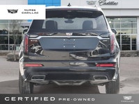 The 2025 Cadillac XT6 AWD Sport, dressed in a sophisticated Stellar Black Metallic exterior and a lu... (image 4)