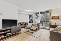 Fully renovated spacious suite features kitchen with modern features and finishes including laminate... (image 3)