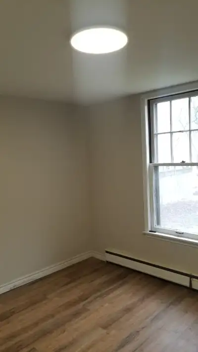 3 Bed Room Renovated apartment in a medium size very clean building, vary large yard, very large win...