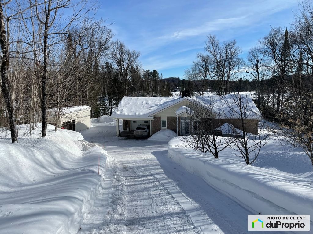 $599,000 - Bungalow for sale in Lac-Saguay — photo 1