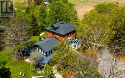 Perched atop a rolling hill on nearly 4 acres in the heart of Mono, this extraordinary country prope...