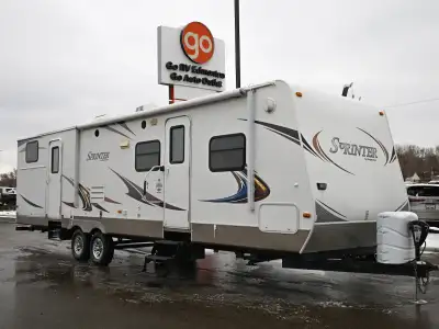 The 2011 Keystone Sprinter 311BHS is a large bunkhouse travel trailer designed for families or group...