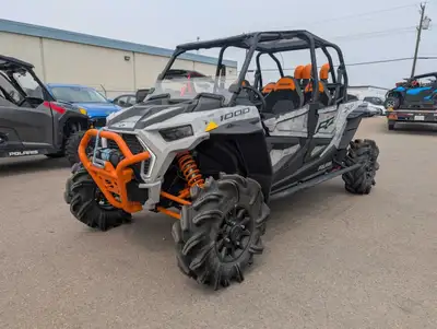 The 2021 Polaris RZR XP 4 1000 High Lifter Edition is built to bring four riders deep into the mud w...