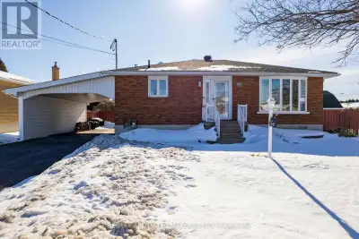 Welcome to this adorable 3+1 bedroom, 2 bathroom bungalow tucked away on a quiet street where life j...