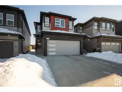 This gorgeous 2-storey home in the desirable southwest community of Cavanagh is the epitome of moder...
