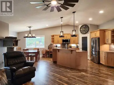 Welcome to this extraordinary executive home, ideally located directly across from the Claresholm Go...