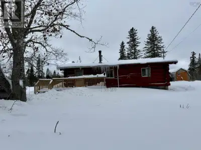 Rare LOG Home in West River Station! This charming one-level home features a large eat-in kitchen, c...