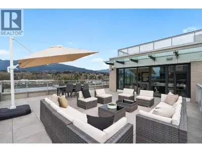 Wake up to breathtaking, panoramic views of the North Shore Mountains in this impeccable 2 Bed + Den...