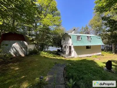 UN PARADIS: Chalet sur un lac privé ( Proctor Lake) avec 904 pieds bord de l'eau, chemin privé, inti...