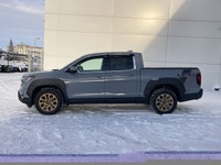 Our 2023 Honda Ridgeline Touring in Sonic Grey with the Honda Performance Development Package is in... (image 4)