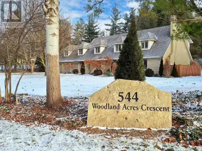 Own your own slice of paradise on 1.15 acres in the prestigious estate community of Woodland Acres!...