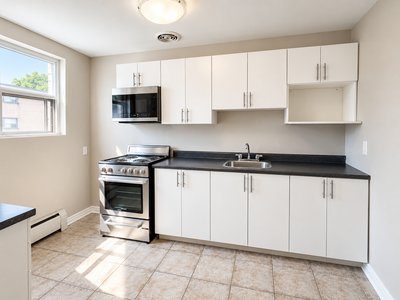 110 Grand Avenue | This bright and cozy bachelor apartment features light LVP flooring, a modern kit...