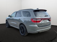 Experience the ultimate fusion of muscle-car attitude and three-row utility in this aggressive SUV,... (image 3)