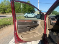 A spacious family minivan with comfortable seating, convenient features, and versatile cargo space,... (image 6)