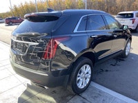 The 2024 Cadillac XT5 Standard AWD, finished in Stellar Black Metallic, combines refined styling, ad... (image 8)