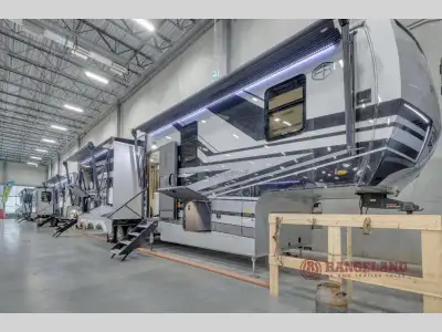 Forest River RiverStone fifth wheel 44DBL highlights: Four Slide Outs Murphy Sofa Two Full Baths Kit...